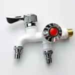 Dual-outlet white faucet with chrome accents and red button.
