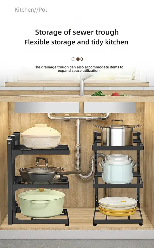 Under-sink storage shelves with various pots and pans.