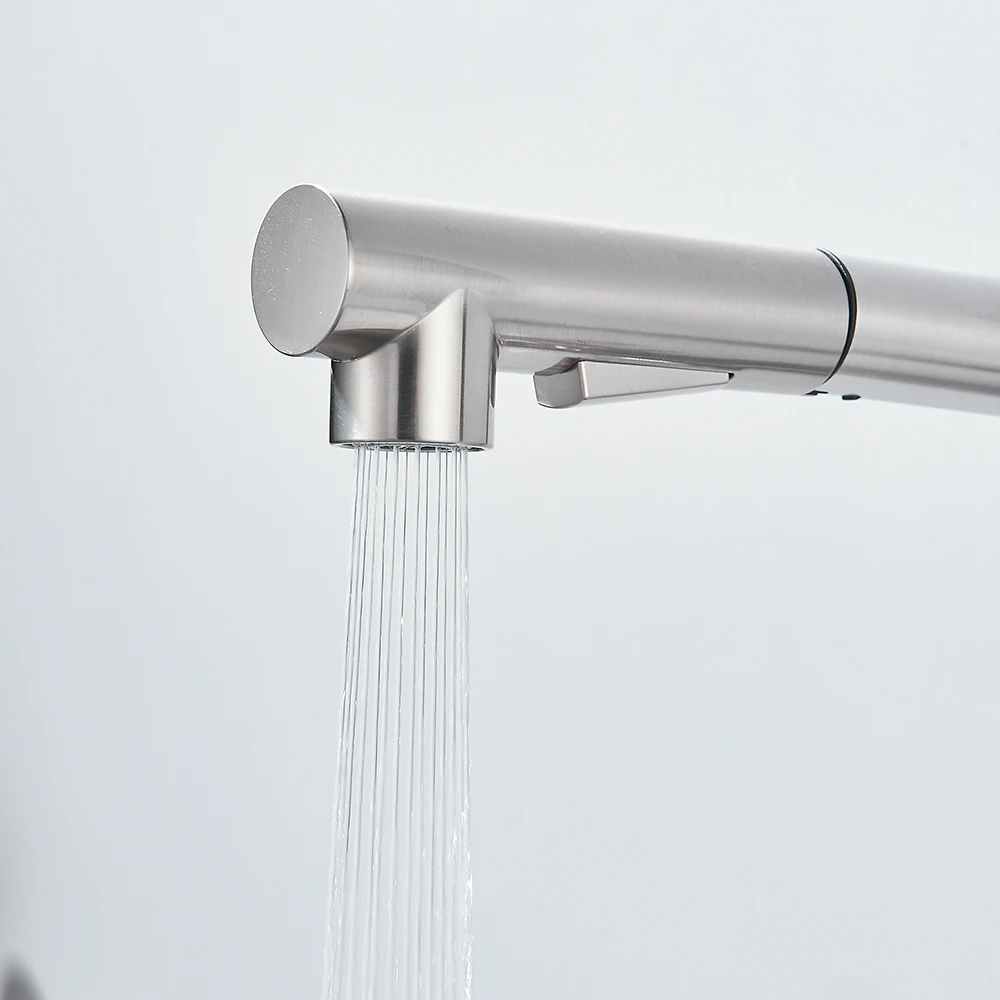 Modern stainless steel kitchen faucet with water flowing.