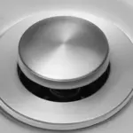 Close-up of a stainless steel sink drain cover