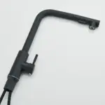 Matte black kitchen faucet with a modern design.
