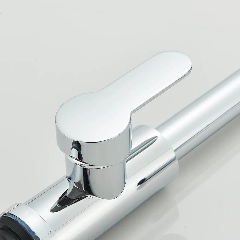 Close-up of a modern chrome faucet handle.