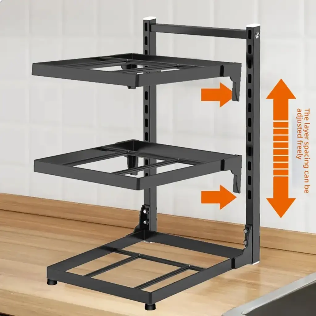 Adjustable black metal kitchen shelf on a countertop.
