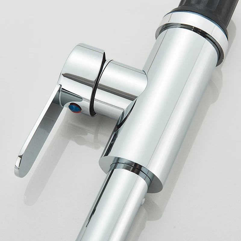 Close-up of a modern chrome faucet with a single lever.