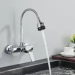Modern kitchen faucet with flexible hose and running water.