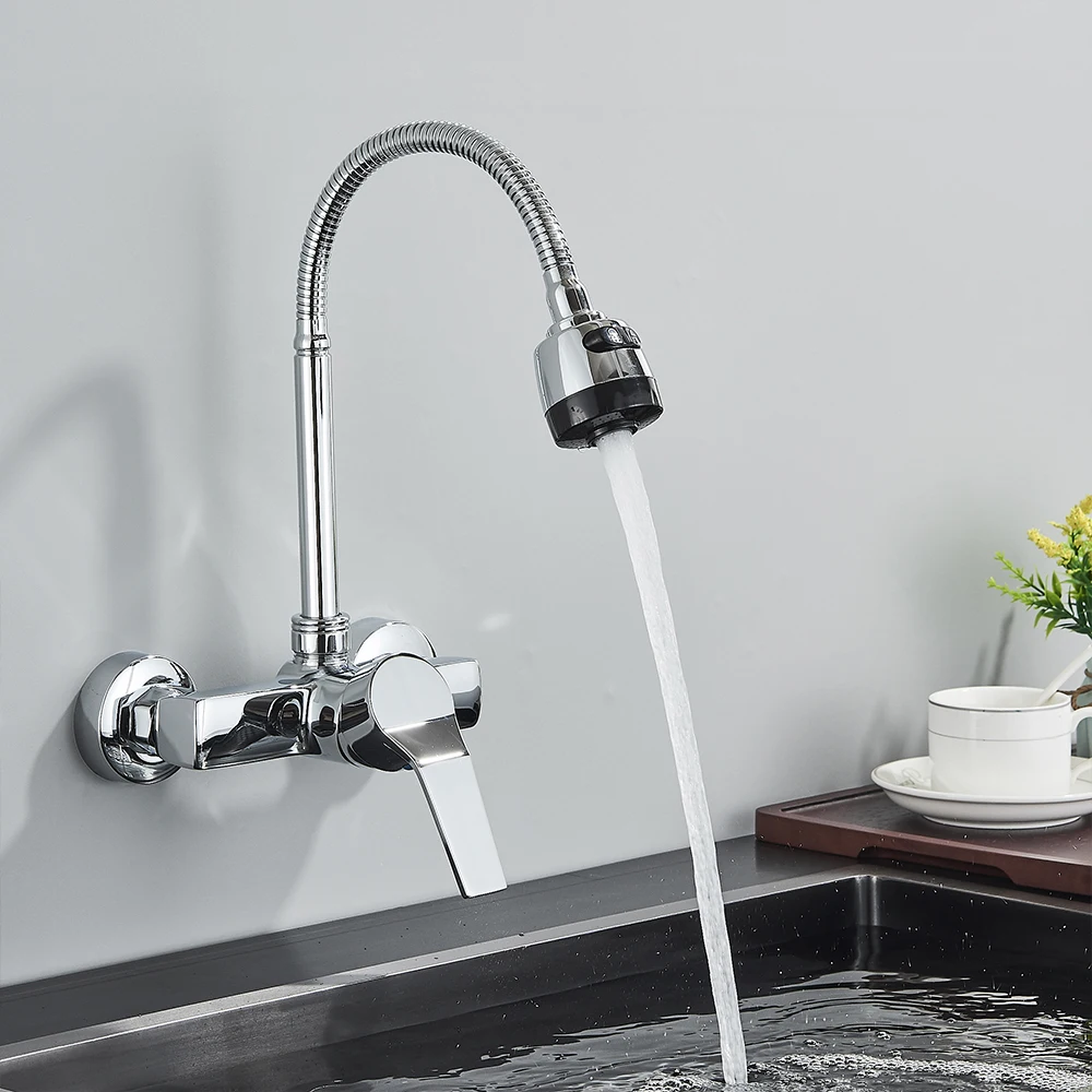 Modern kitchen faucet with flexible hose and running water.