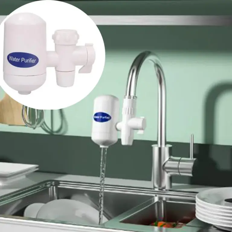 Kitchen faucet with attached water purifier filtering water.
