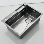 Stainless steel kitchen sink with modern design.