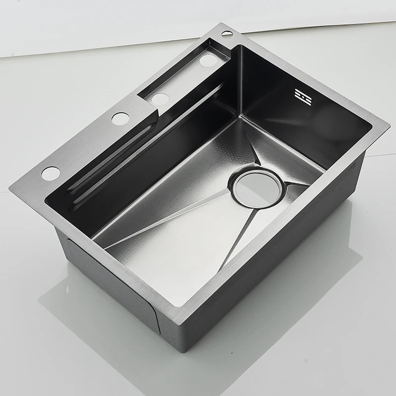 Stainless steel kitchen sink with modern design.